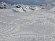 footprints in the snow make a geometric pattern by artist Simon Beck