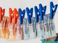 euros bills hanging to dry on a clothes line